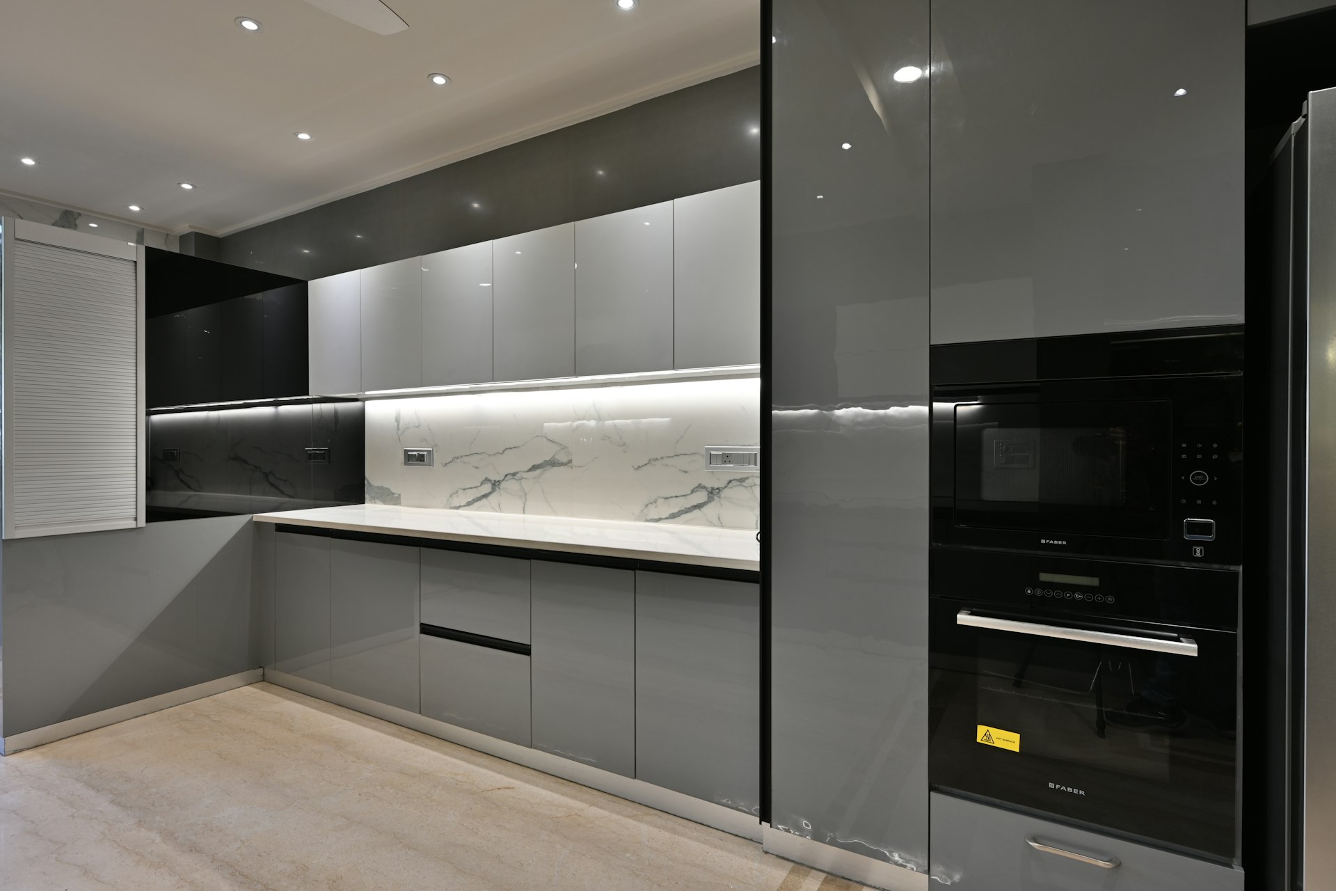 a modern kitchen with a marble counter top