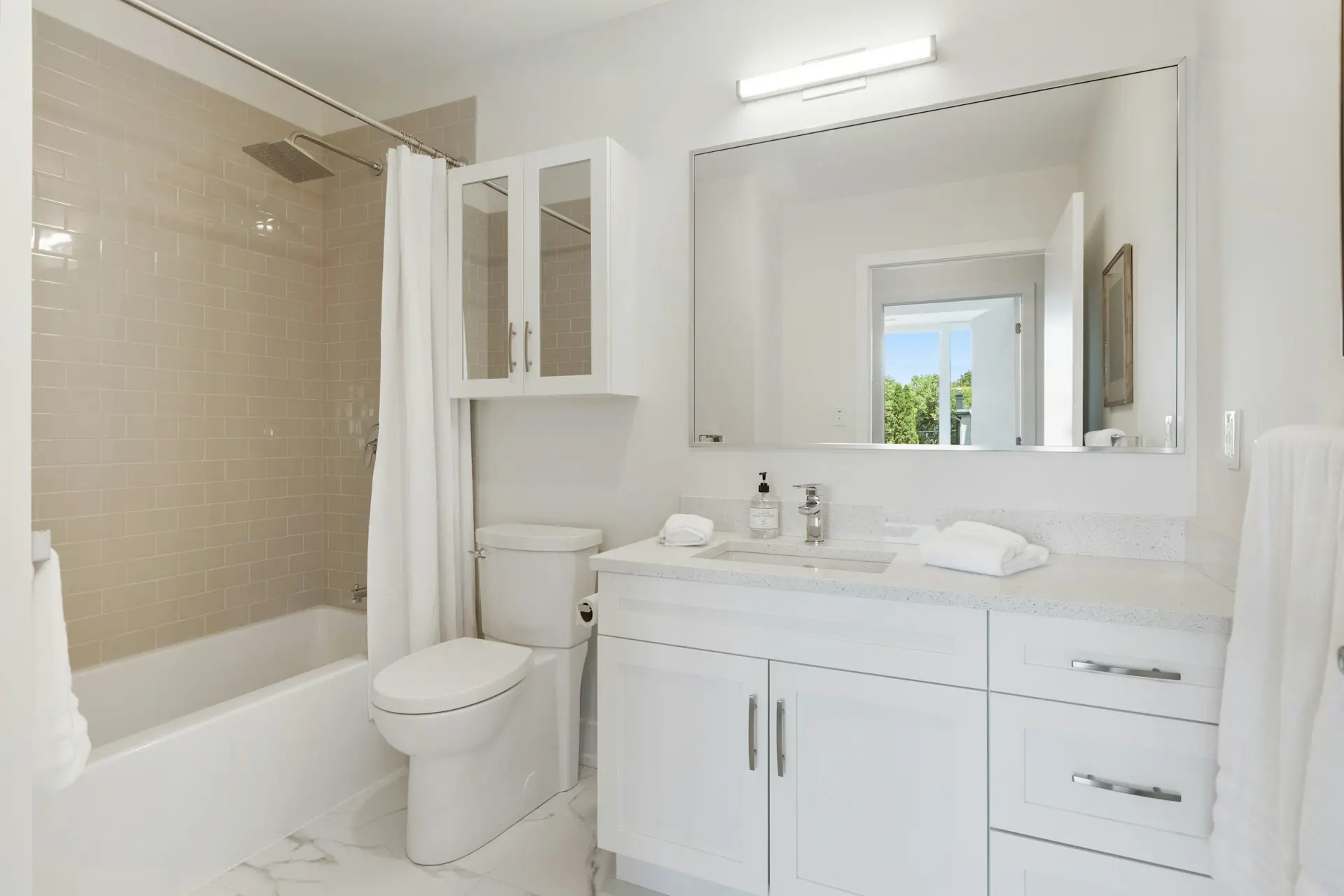 white ceramic sink with mirror