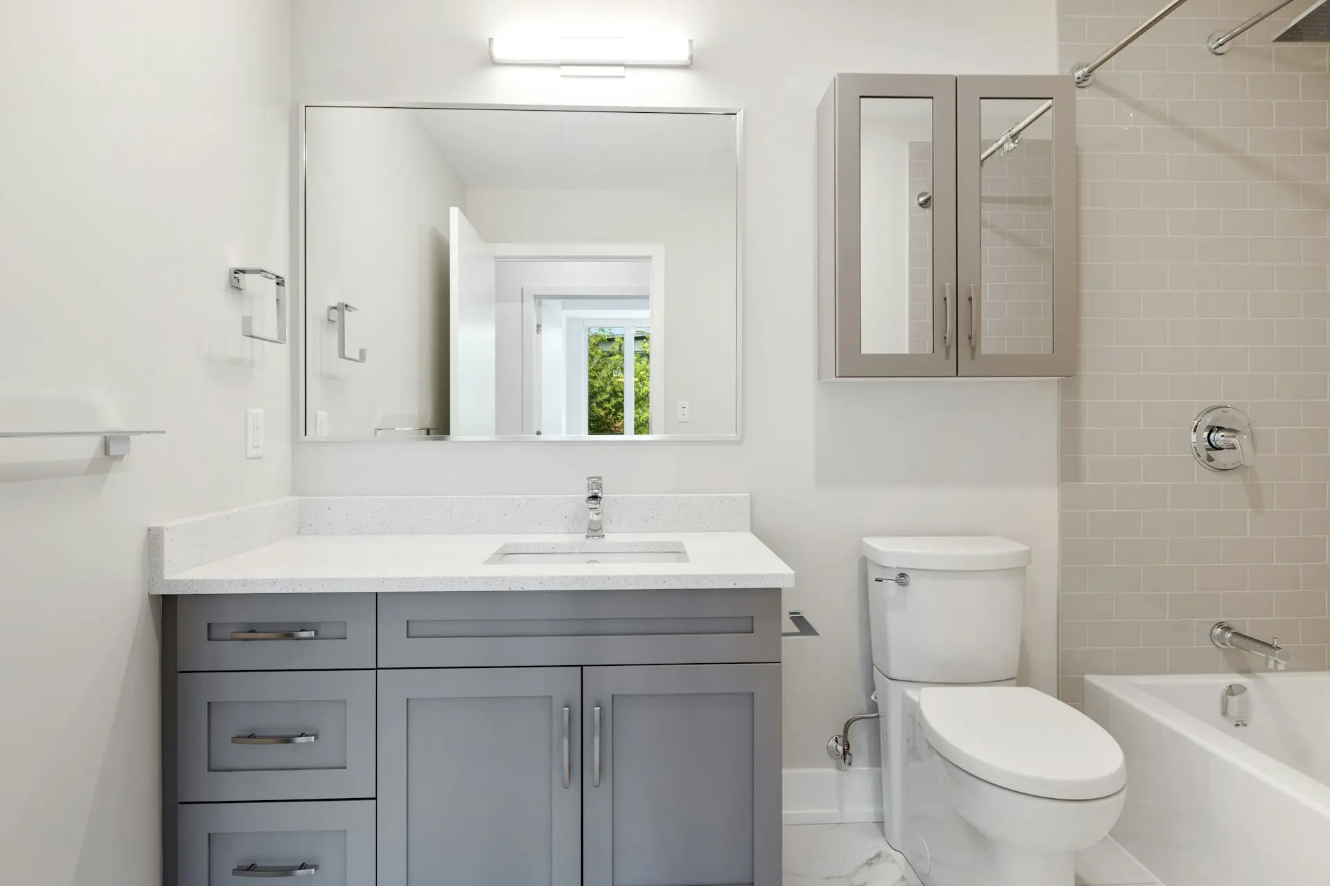 white ceramic sink beside white ceramic toilet bowl