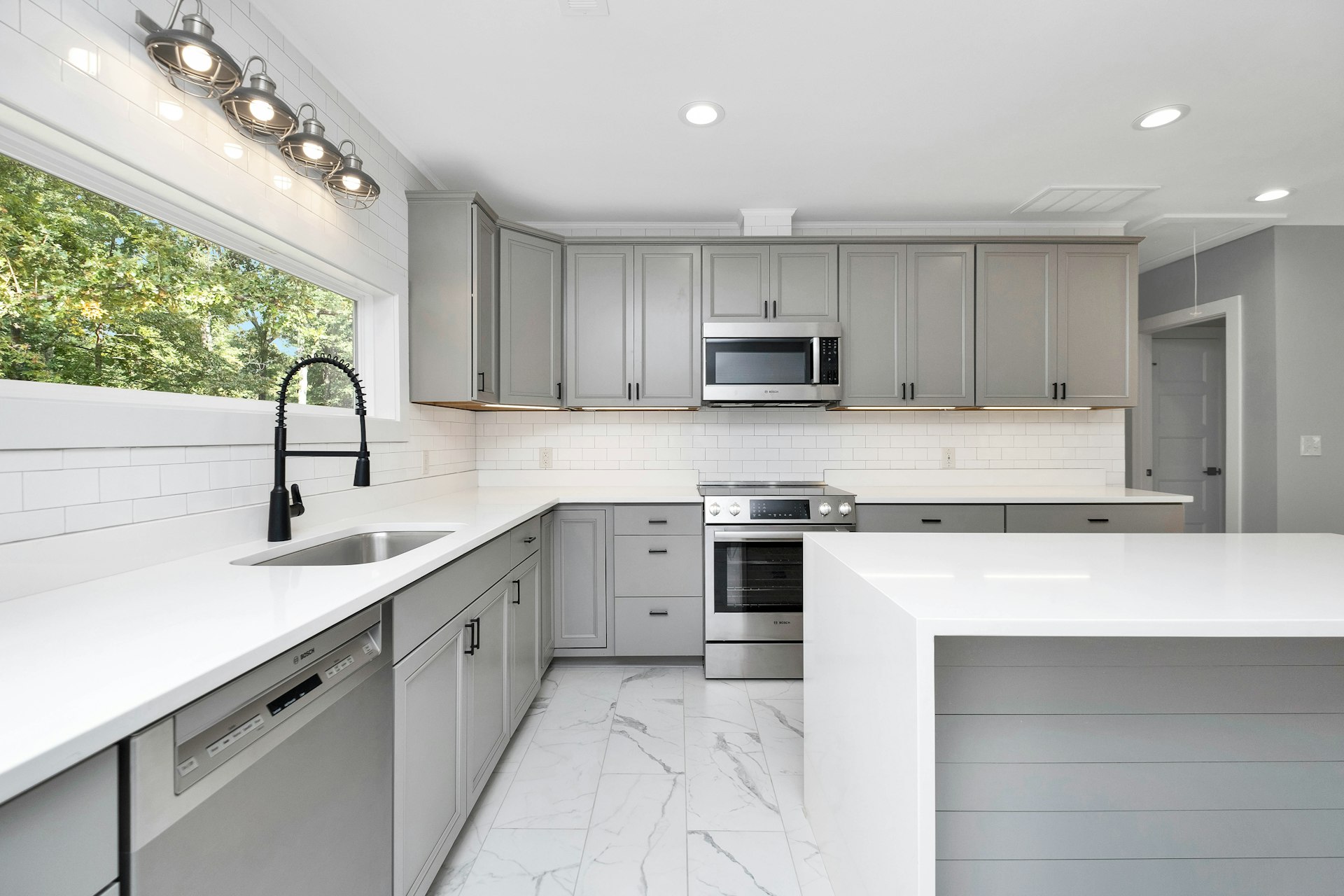 a kitchen with white cabinets