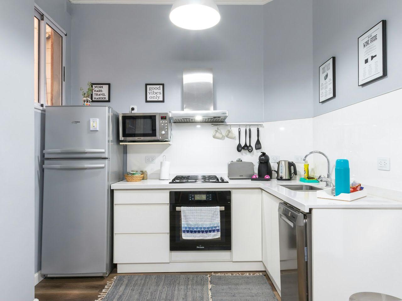 white top mount refrigerator beside white wall